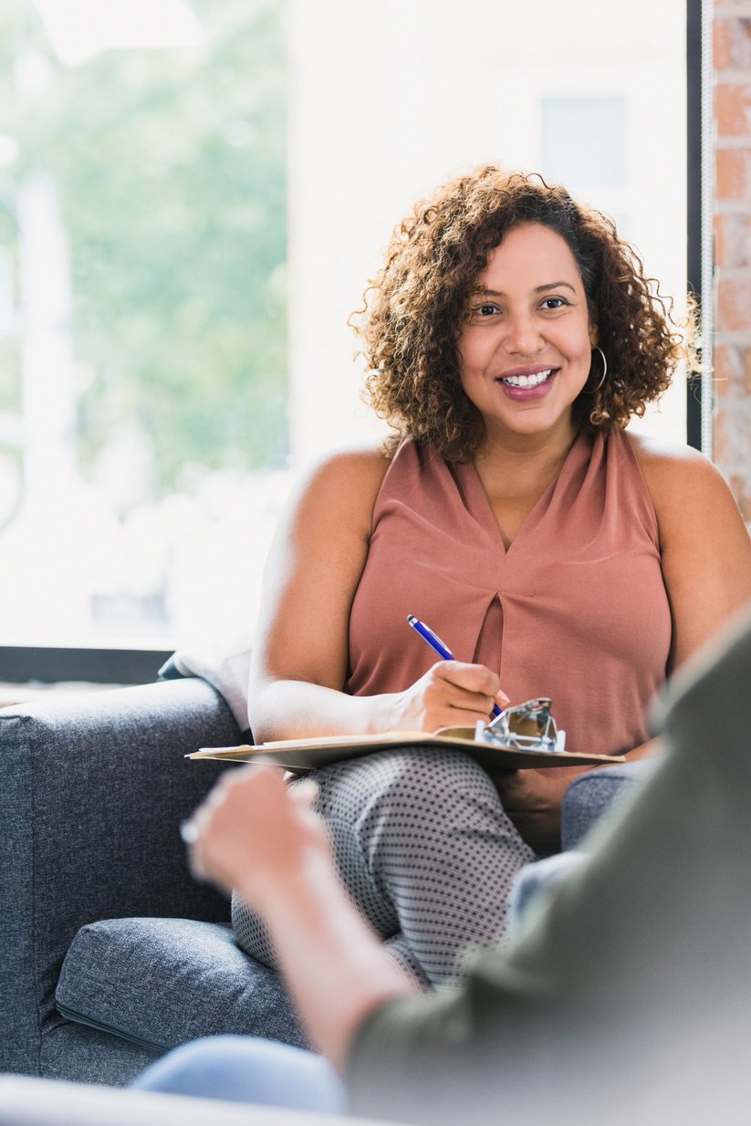 Therapist counsels female patient